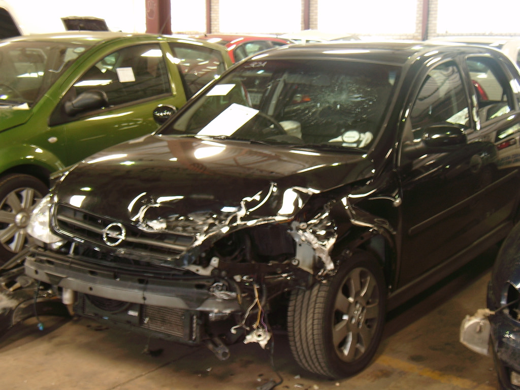 Badly damaged car being sold for cash in Perth wrecking garage